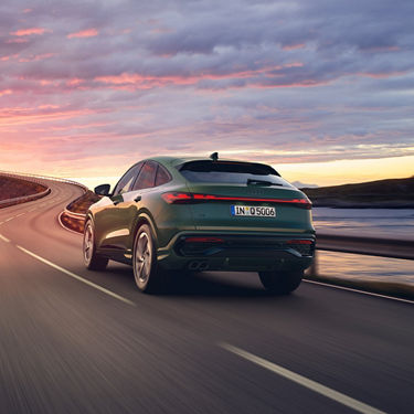 Q5 driving into sunset