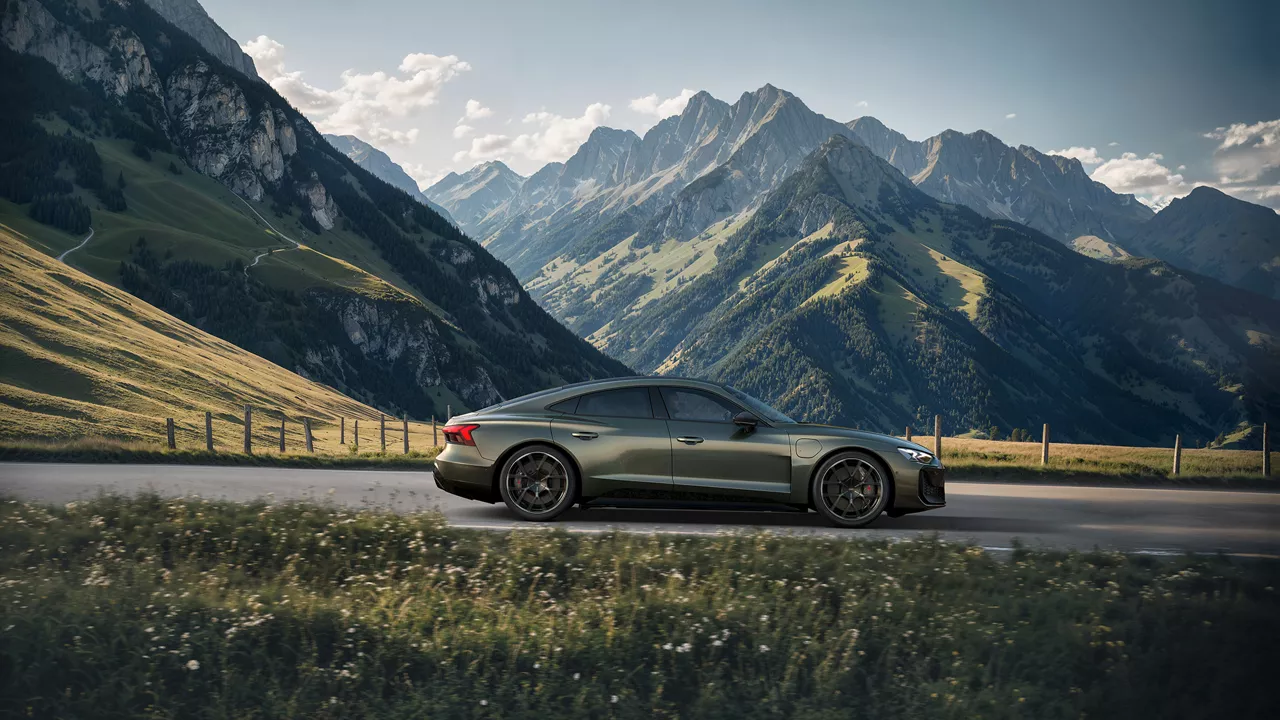 Dark green Audi RS e-tron GT performance (side view) driving through a mountainous landscape