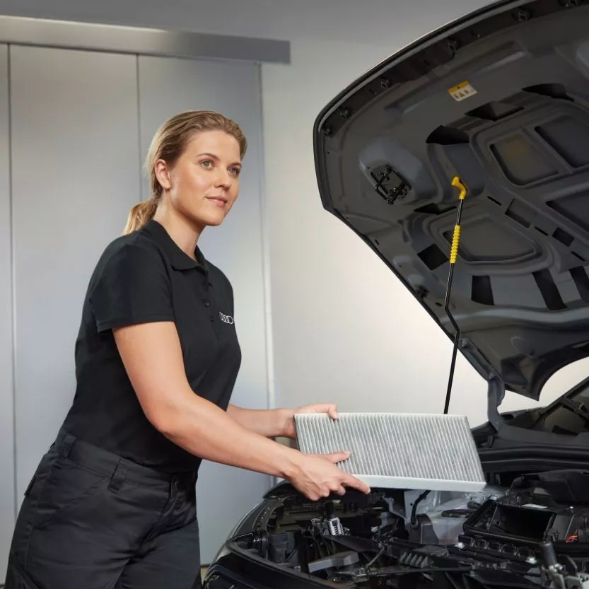Audi technician inspecting a car