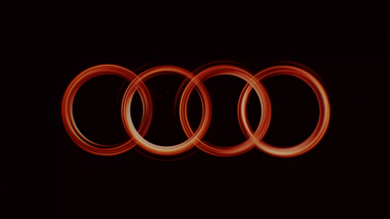 Red Audi logo circles on black background