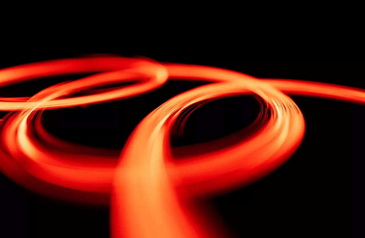 Audi logo circles in fiery red with yellow details on black background