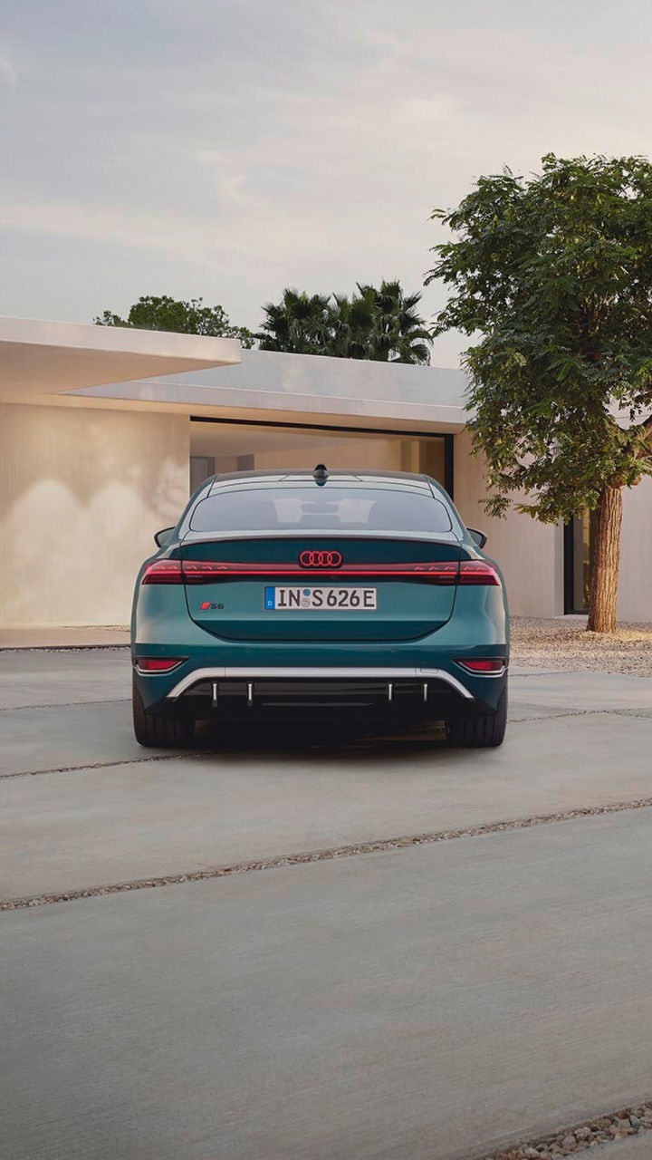 Rear view of a parked Audi electric vehicle in an urban setting