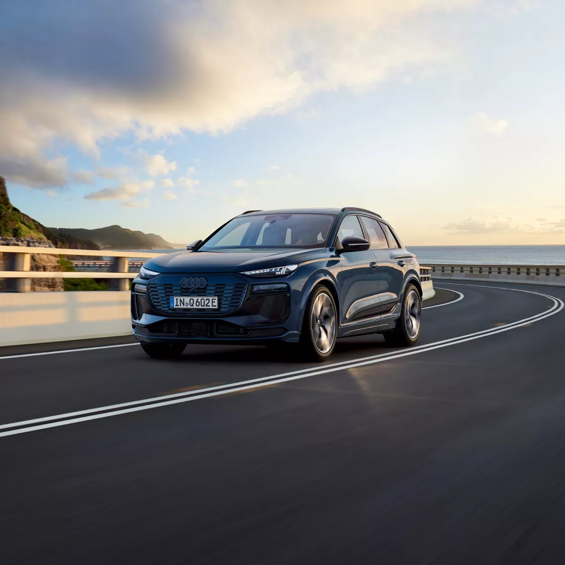 Dark Audi Q6 e-tron in an open road