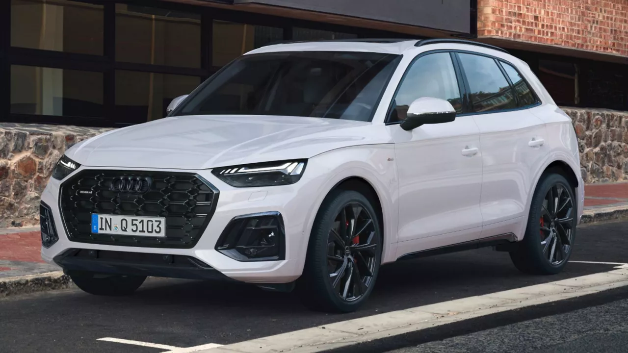 White Audi Q5 parked on a city road