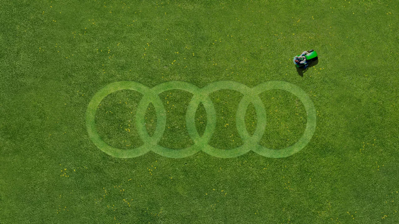 Audi logo of four rings drawn on lawn