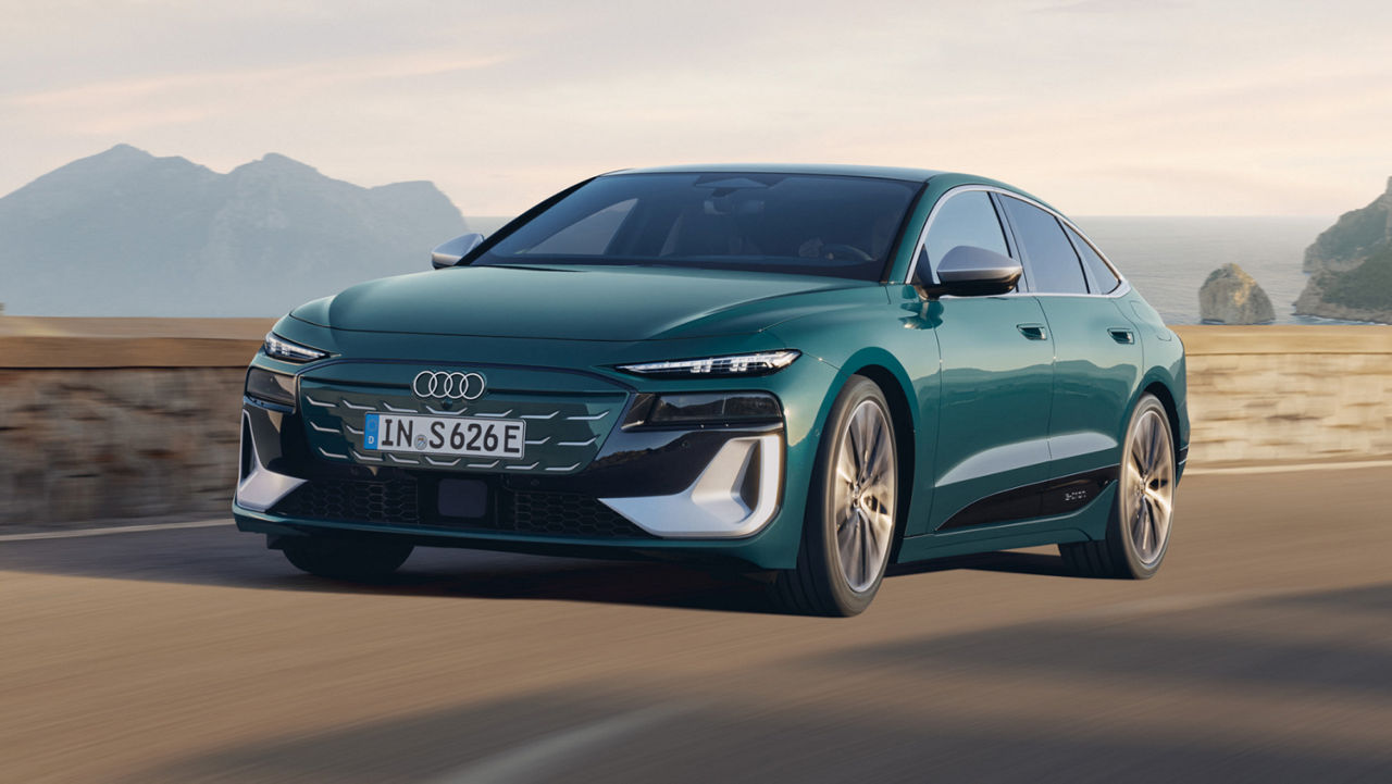 Dark green Audi Car on scenic Mountain road