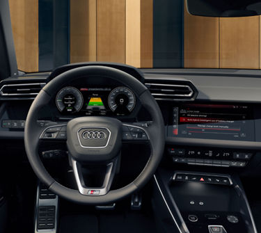 Audi steering wheel from drivers POV showcasing climate controls 