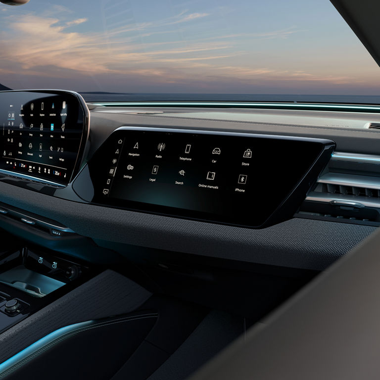 Car dashboard with sleek touchscreen displays showing various icons like navigation, radio, and settings. The interior feels modern and tech-savvy.