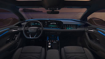 Interior of an Audi car with dim lights and sea view outside
