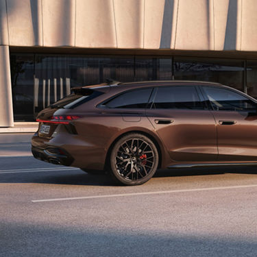 Close up of the rear of a brown A6 Avant while moving in the road