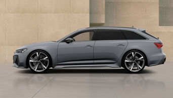 Audi RS 6 Avant parked besides beige modern building