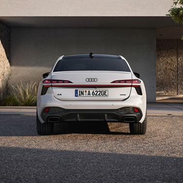 Rear view of a white Audi A6 Saloon e-hybrid