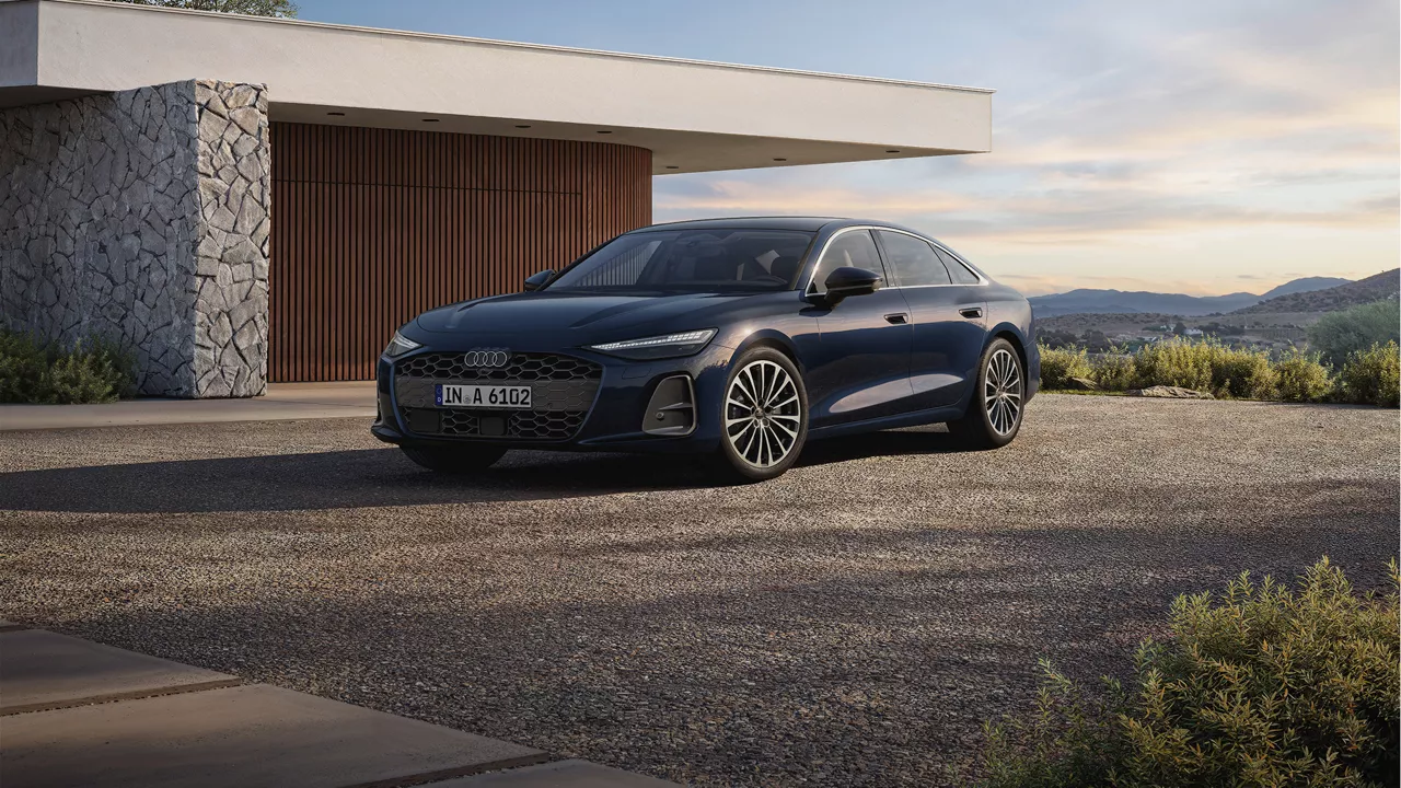 Blue Audi A6 Saloon parked in front of a modern house