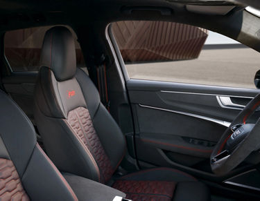 Car interior with leather seats and modern dashboard design.