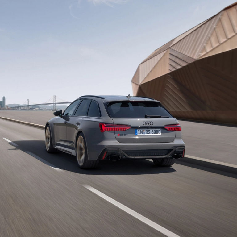 Audi RS 6 Avant performance moving along a  racetrack.