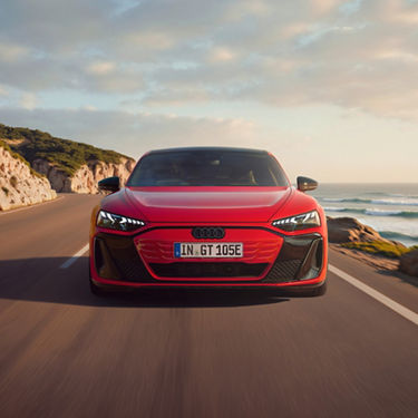 Red Audi e-tron GT quattro front view while driving