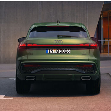 Rear shot of a green Audi SUV.