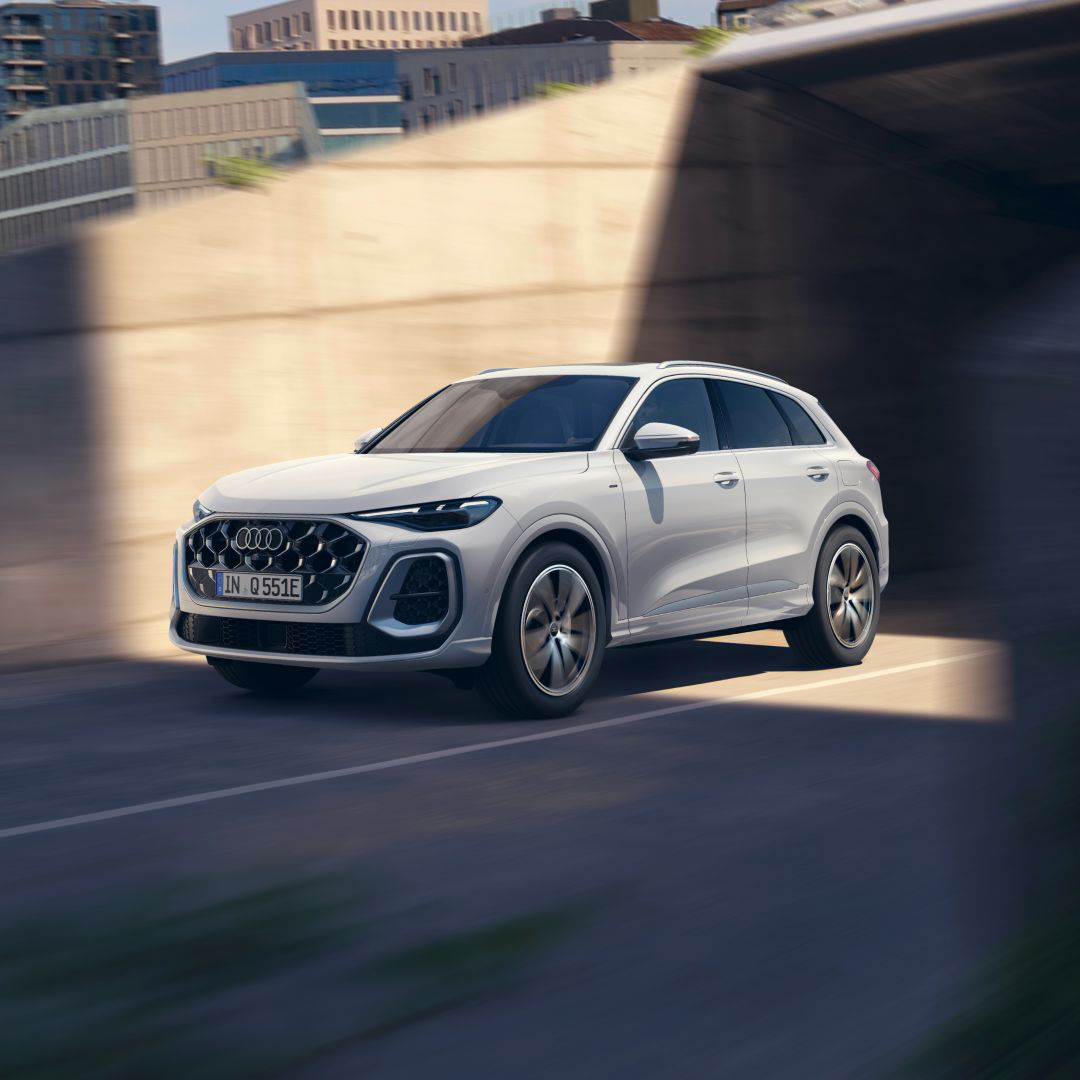 White Audi Q5 e-hybrid on the road