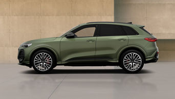 A green Audi SQ5 SUV with modern design elements, showcasing its profile against a minimalist concrete backdrop. 