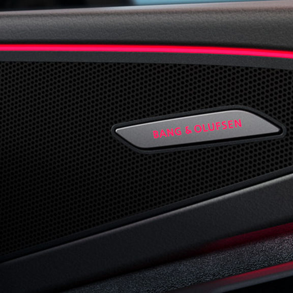 Close up of the red colour details on the side of an Audi door interior