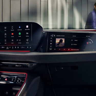 Car interior with central console and touchscreen.