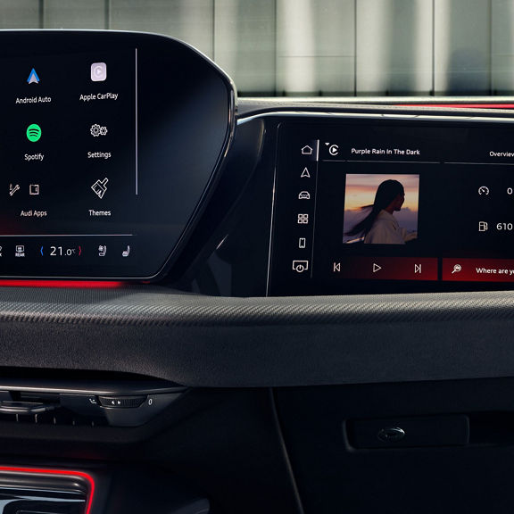 Car infotainment screen displaying radio, media, phone, and navigation options.