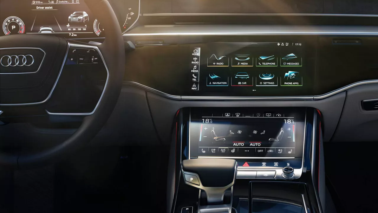 The interior of an Audi A8 with the focus on the digital dashboard and steering wheel