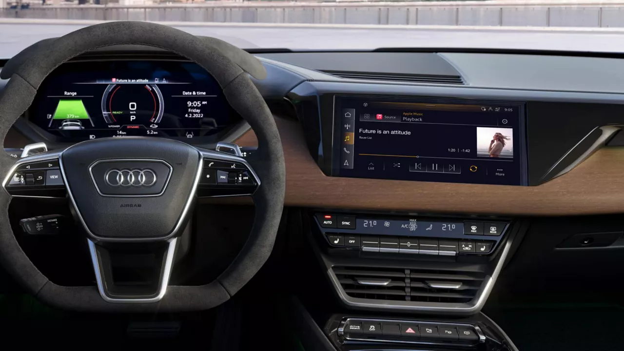 The interior of an Audi e-tron GT with the focus on the digital dashboard and steering wheel