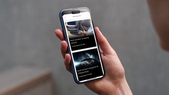 A person holds a smartphone displaying Audi connect features: remote control and navigation, with subscription details visible.