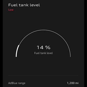 Front view of a black SUV on a white background. Text shows "30 mi Range" and "Fuel tank level Low," highlighting low fuel status.