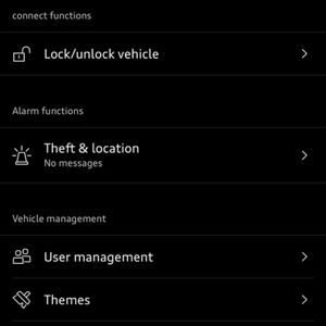 Interface screen showing sections: "Alarm functions" with "Theft & location," and "Vehicle management" with options for user management, themes, privacy settings, and map updates.