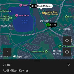 Map showing the location of "Audi Milton Keynes" on Northfield Drive. The interface includes options for sending, routing, and saving the address.