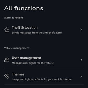 Interface screen showing sections: "Alarm functions" with "Theft & location," and "Vehicle management" with options for user management, themes, privacy settings, and map updates.