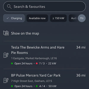 Map showing Milton Keynes with several Audi charging stations marked. Each station lists available slots and kW ratings. Nearby landmarks include Melis Restaurant and Marks & Spencer.