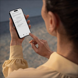 A woman using the myAudi app