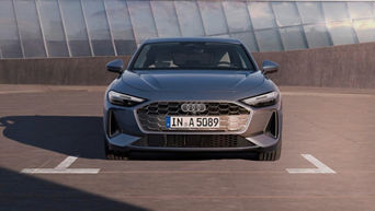 A grey Audi car from the front while parked