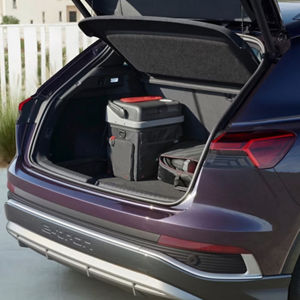 The boot of an Audi car packed for a trip