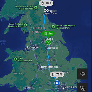 Map of England showing a route from London to Newcastle upon Tyne. Battery indicators show 73% near Birmingham and 10% near Newcastle. National parks are marked.