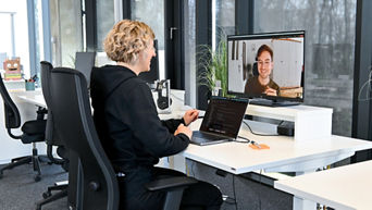 Nadine and David, Software Engineers SDC, talk to each other virtually via computer