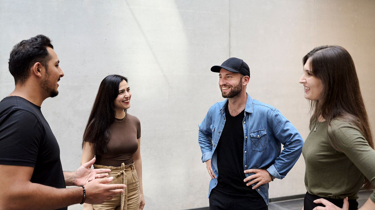 Sebastian Kister is in discussion with colleagues