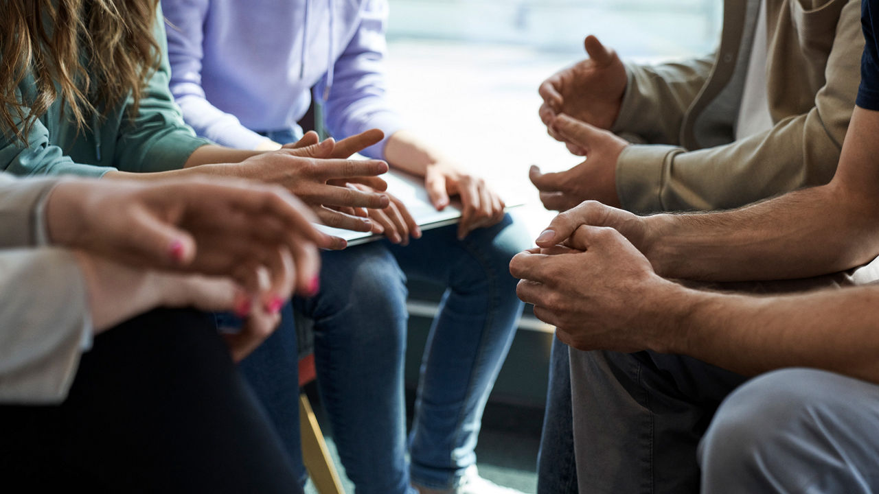 Hands in a meeting