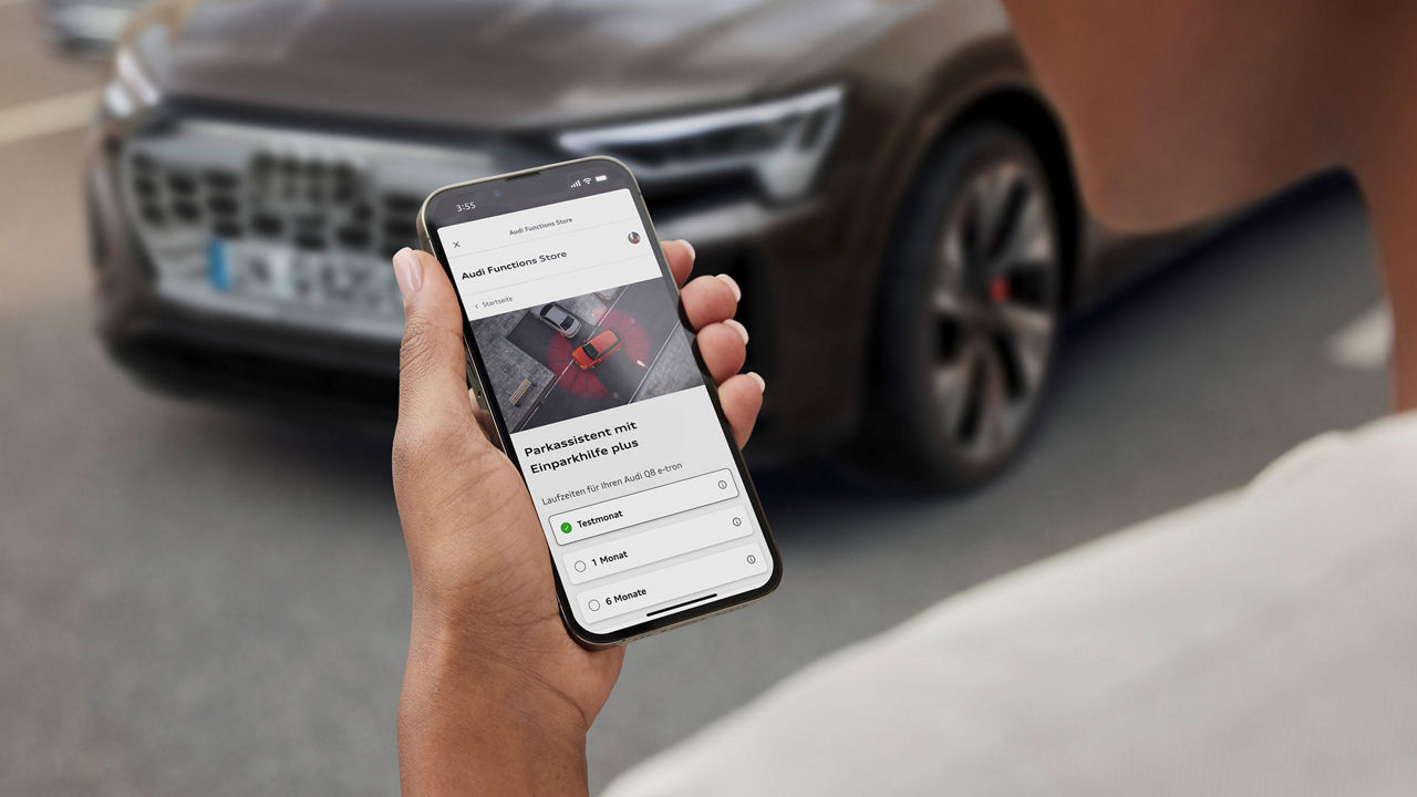 The smartphone display shows the order screen for the parking assistant with parking aid plus. The ‘trial month’ option is selected.