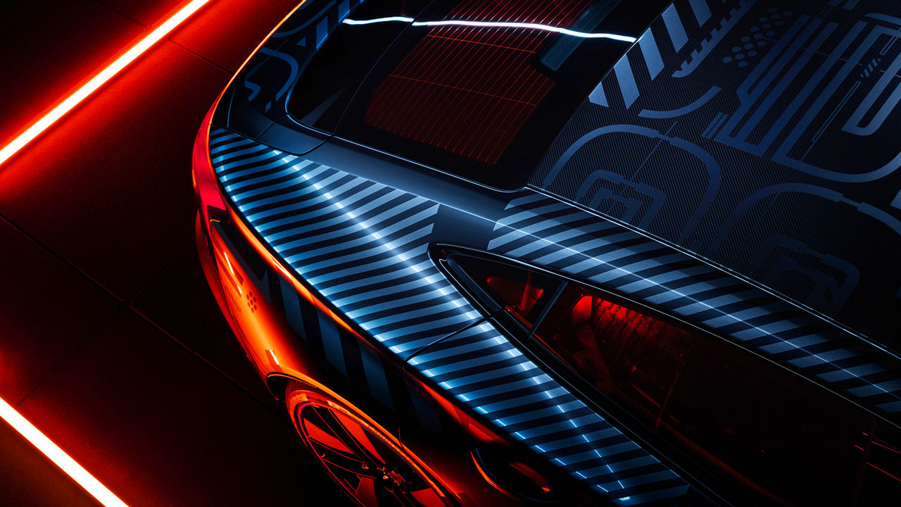 Vehicle rear with stripe foiling, illuminated by colourful neon light
