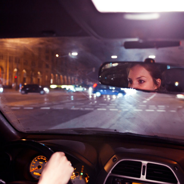 The road through the windshield of a car