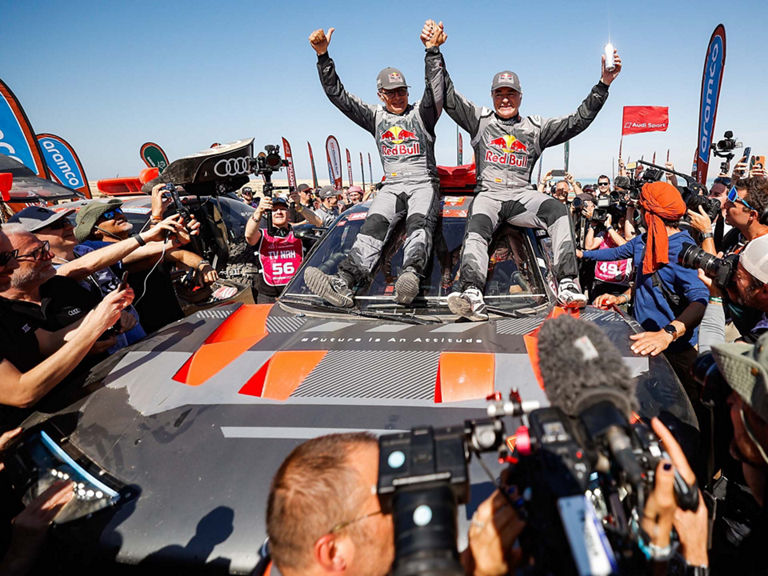 Carlos Sainz and Lucas Cruz at the finish of Dakar Rally