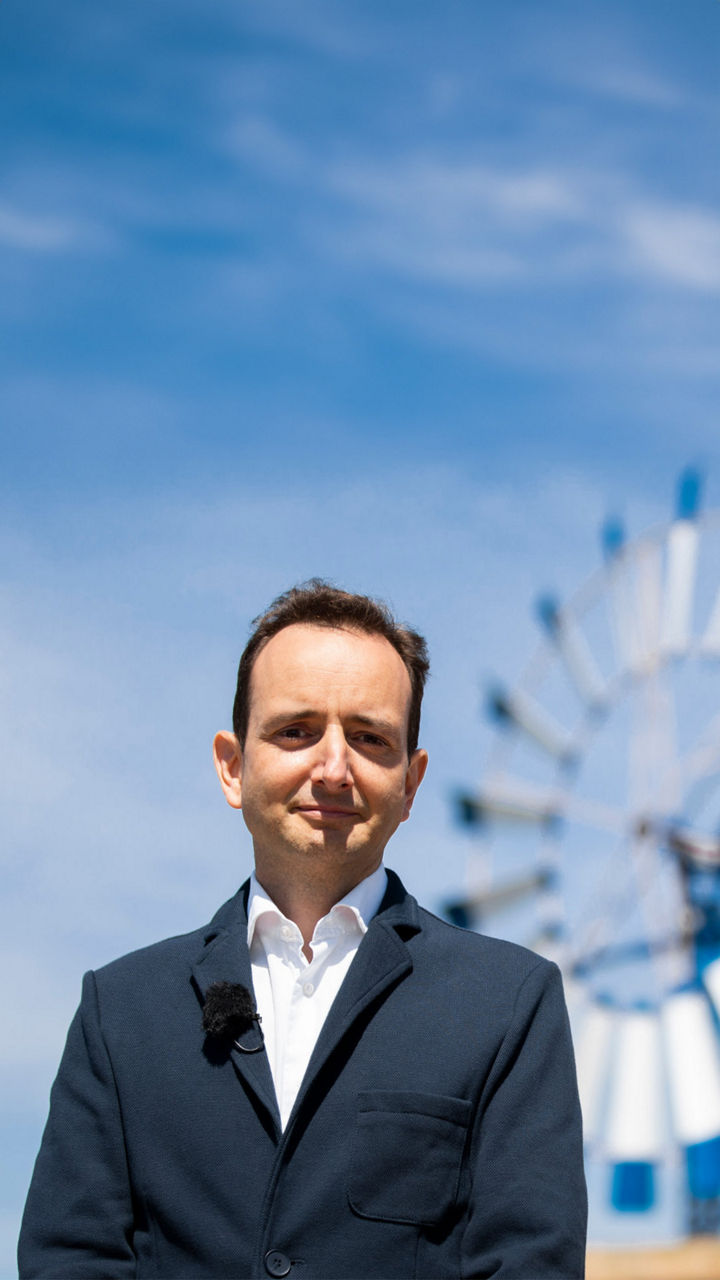 Audi developer Francisco Trigueros Morera de la Vall in front of a windmill