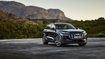 Audi Q6 e-tron in front of a mountain backdrop