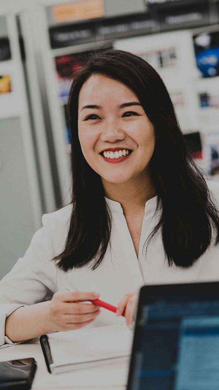 Young woman at her desk