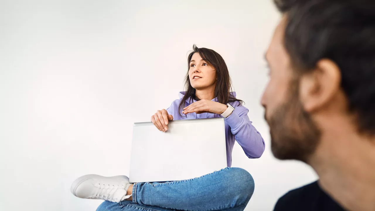 Woman sitting on chair with her laptop
