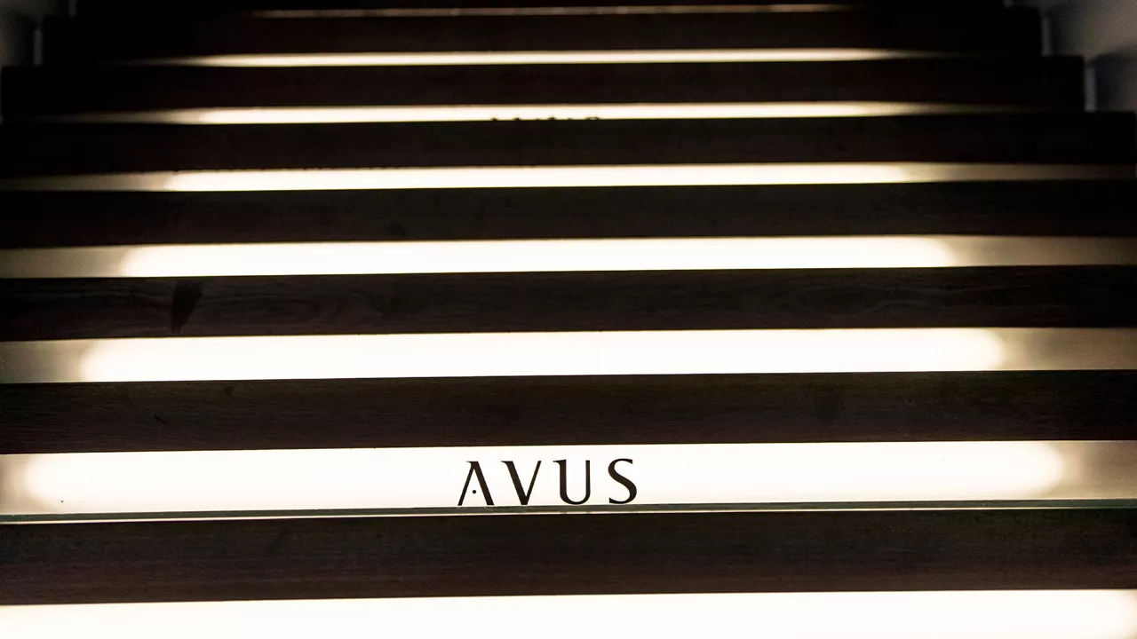 Illuminated steps with the AVUS logo